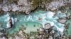 Aerial view of kayaker in rapids