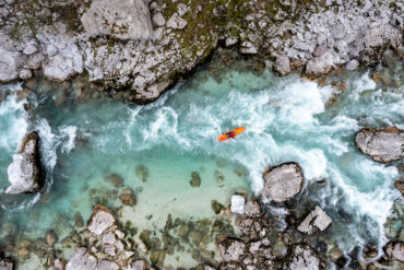 Aerial view of kayaker in rapids