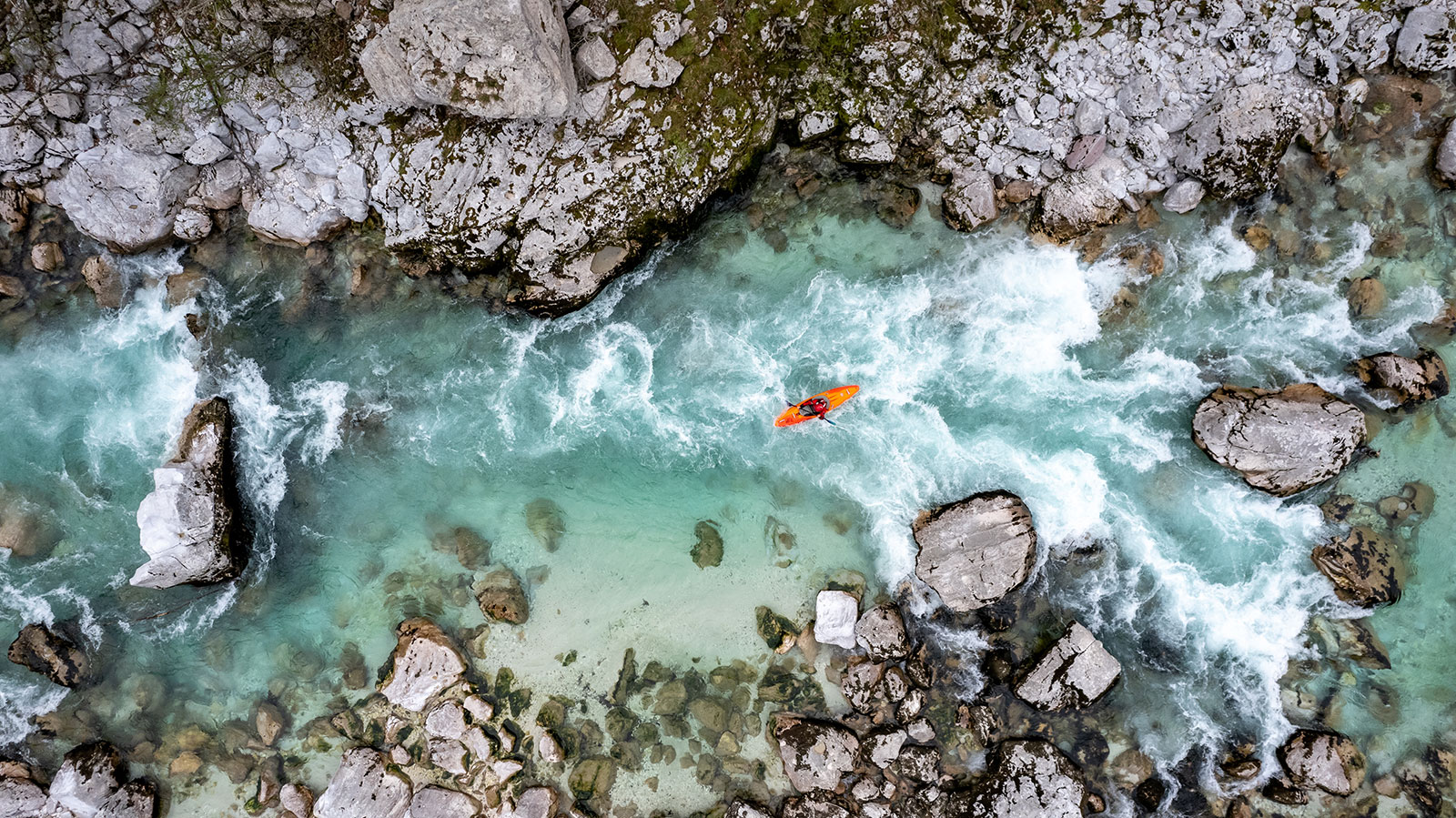 Aerial view of kayaker in rapids