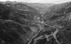 Black-and-white aerial of river and mountains