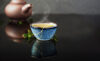 Kintsugi cup with tea and teapot