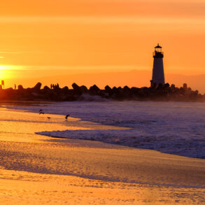 Santa Cruz beach and lighthouse at sunset