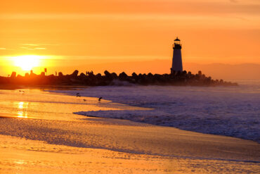 Santa Cruz beach and lighthouse at sunset