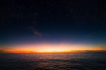 Evening with starry sky over the sea
