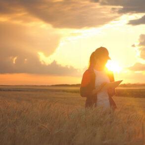 Female farmer with sunlight and storm