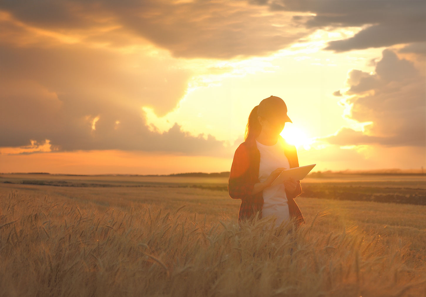 Female farmer with sunlight and storm