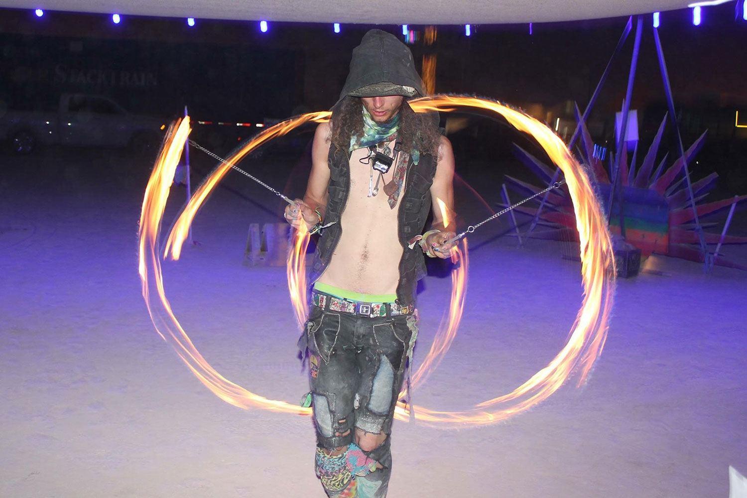 Fire twirler at night at Burning Man