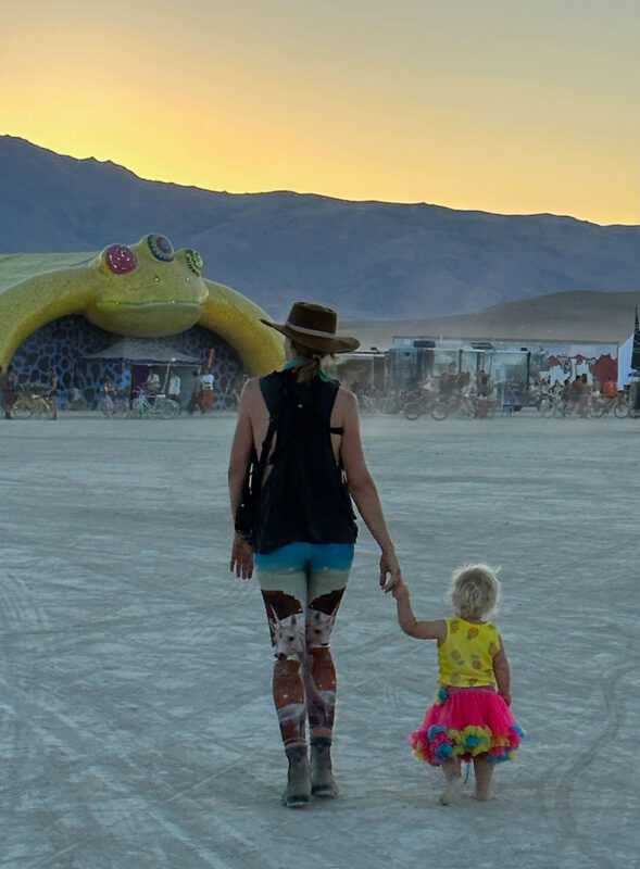 Mother and daughter at twilight at Burning Man