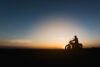 Silhouette of man on motorcycle
