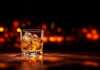 Glass of whisky with low lights