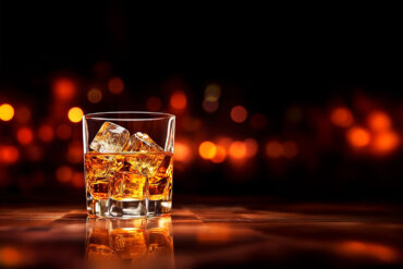 Glass of whisky with low lights