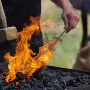 Blacksmith's fire and hammer at the forge