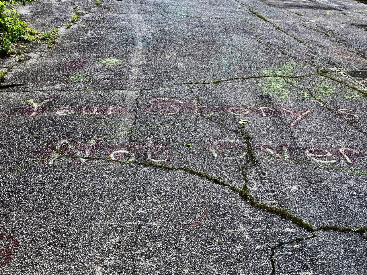 The Story's Not Over graffiti on road in Centralia, Pennsylvania.