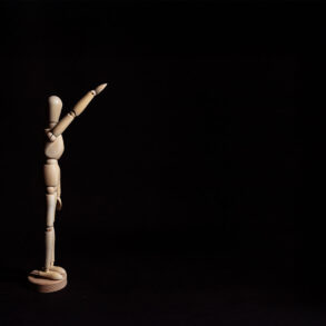 Wooden figure Nazi salute