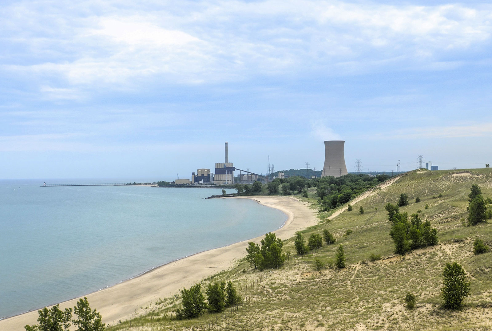 The natural landscape of Indiana Dunes National Park with the NIPSCO Michigan City Generating Station in the background.