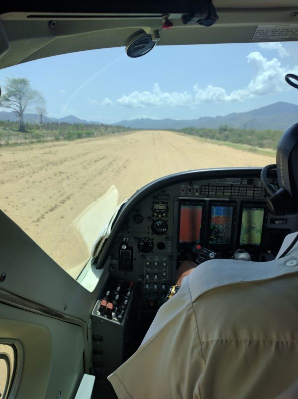 Landing strip view from cockpit of plane