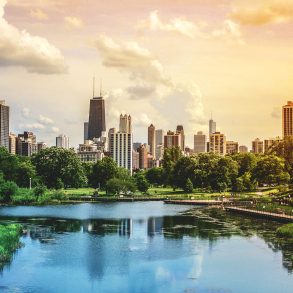 Chicago skyline viewed from park with lake in afternoon light